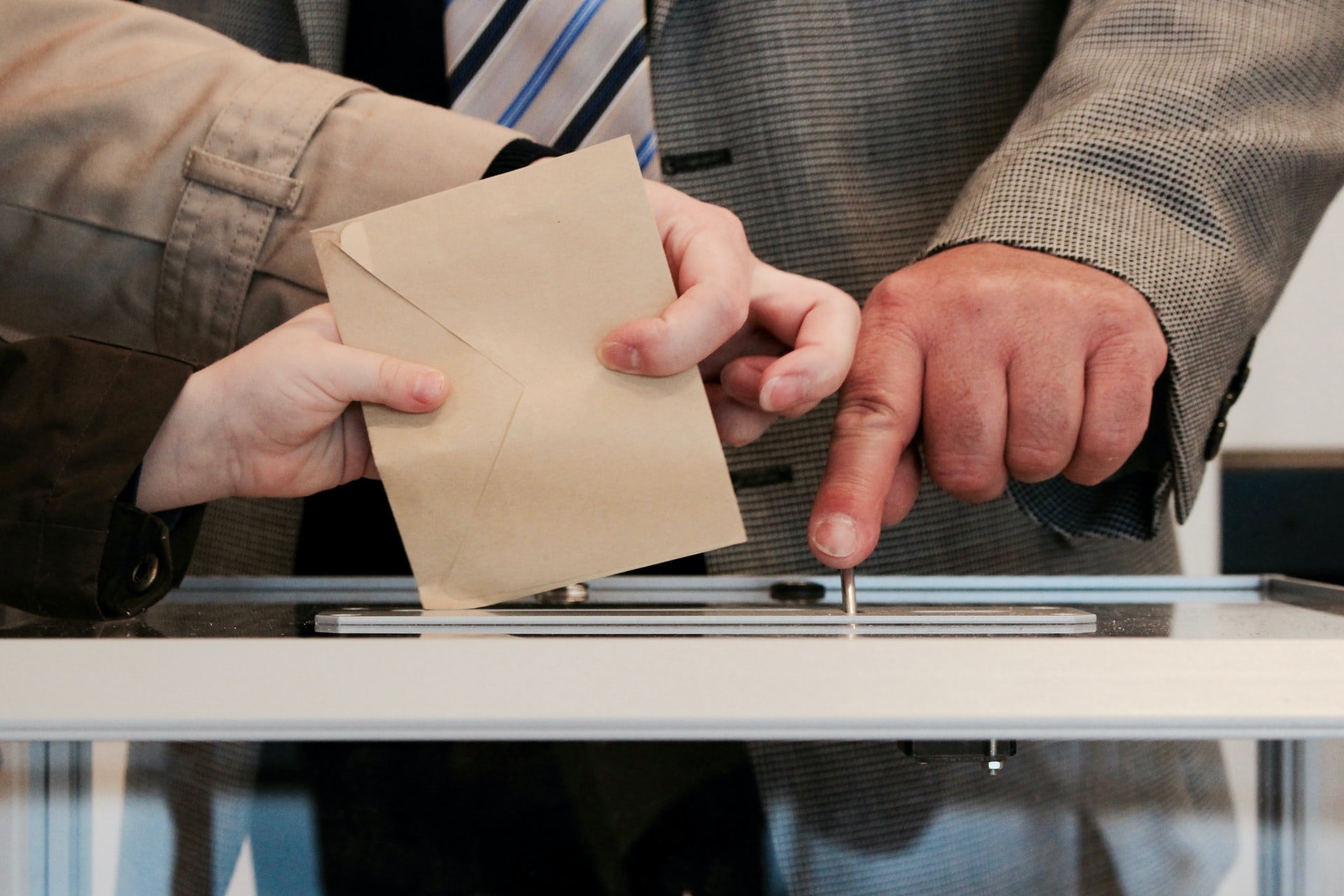 Voters submitting their ballot paper.