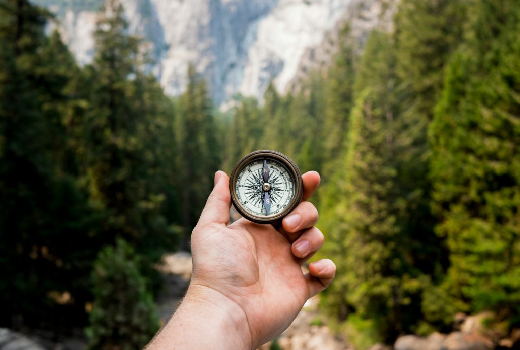 Person holding a compass to illustrate the navigation of The Verge stage to Ethereum that will bring a range of efficiency and security improvements to the blockchain platform and crypto and web3 users.